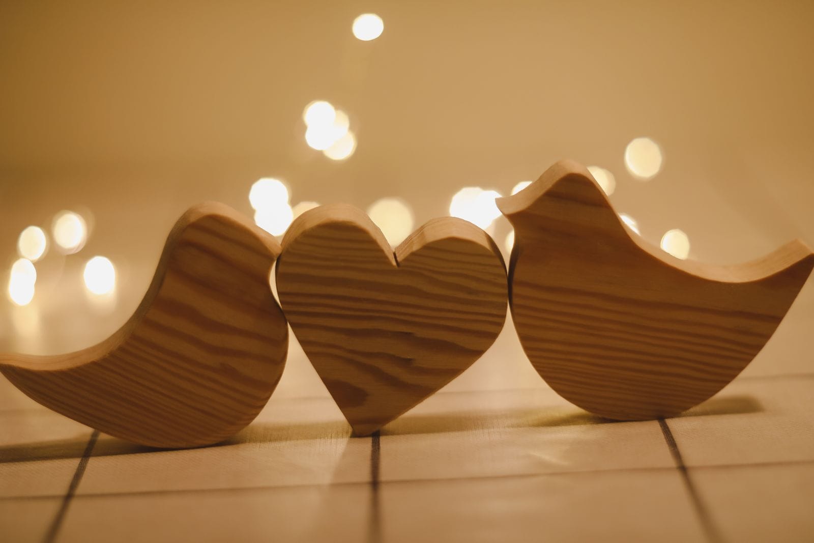 Two Wooden Birds And Heart Made By Bokeh Lights Background Valentines Day Wedding Easter Card With Wooden Figures Of Birds Home Decor